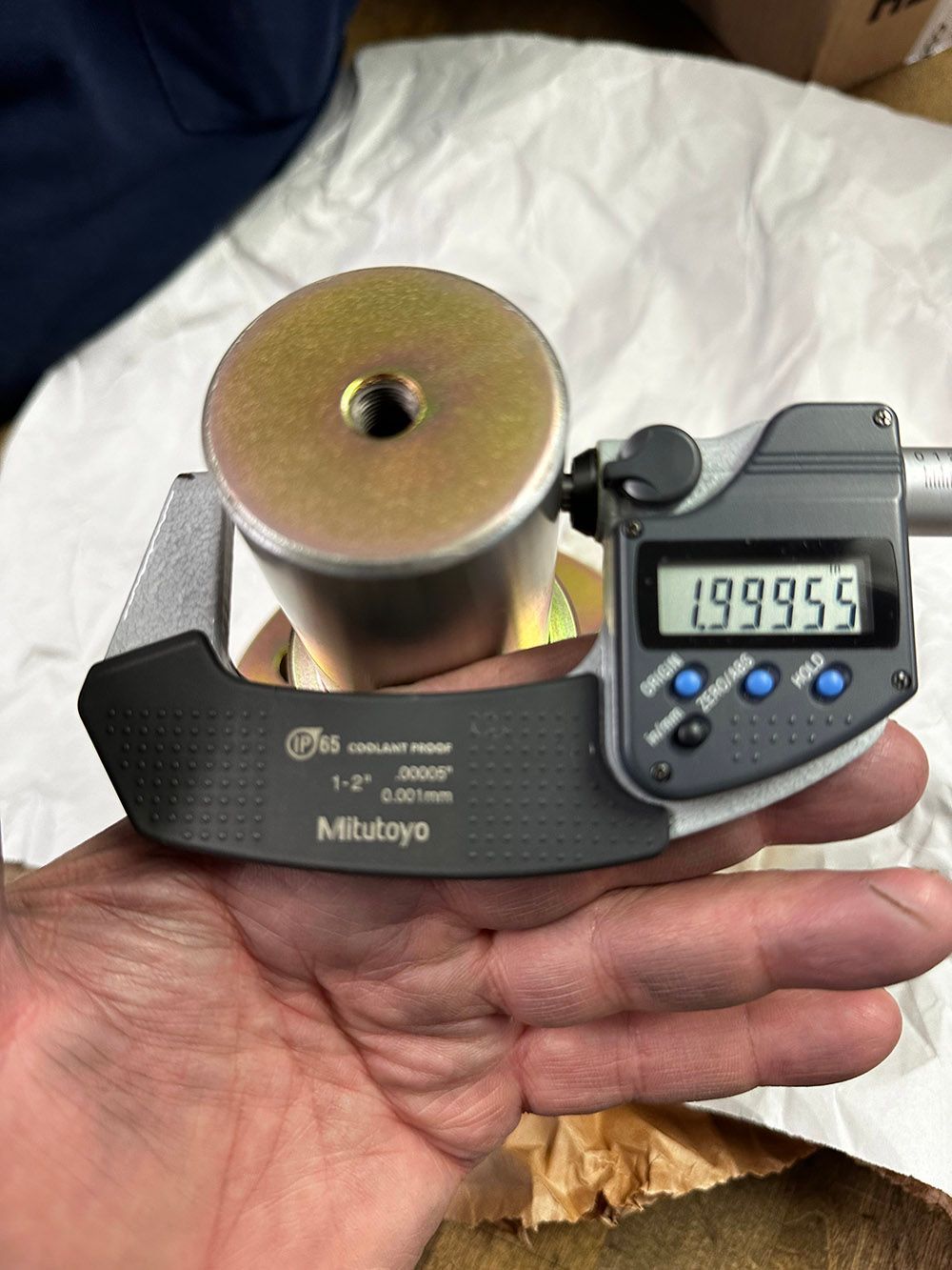 Miking and verifying measurements after zinc plating by Seminole Metal Finishing.