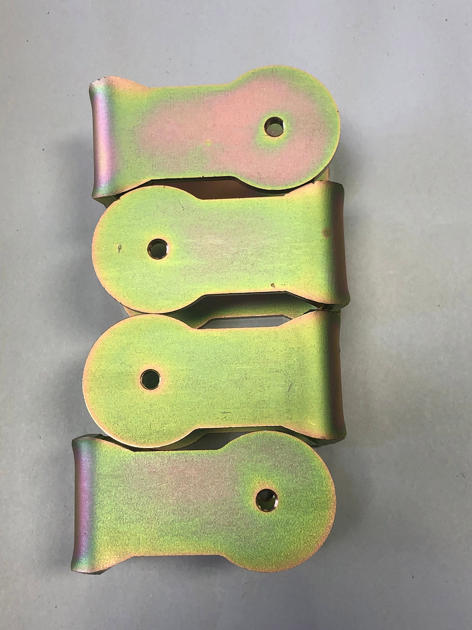 Yellow zinc plated steel brackets by Seminole Metal Finishing.