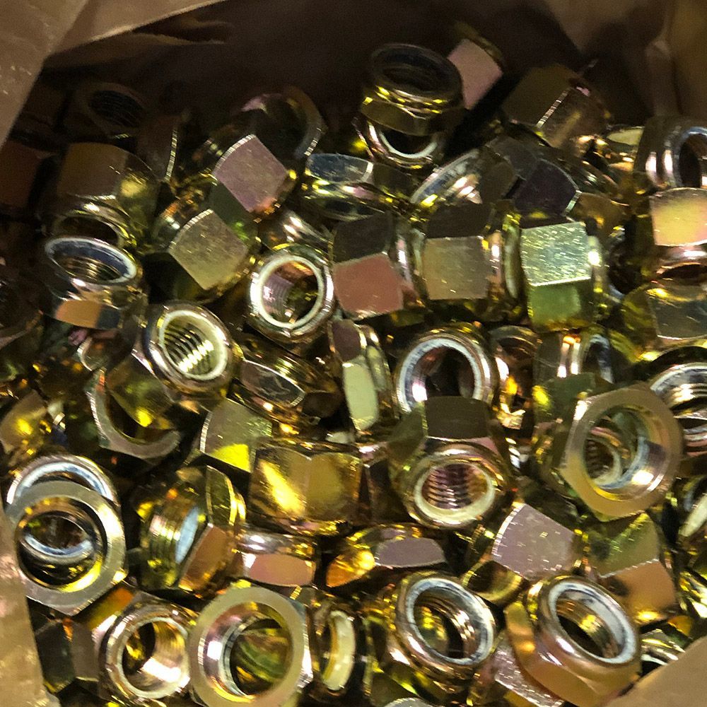 Yellow zinc plated lock nuts by Seminole Metal Finishing.