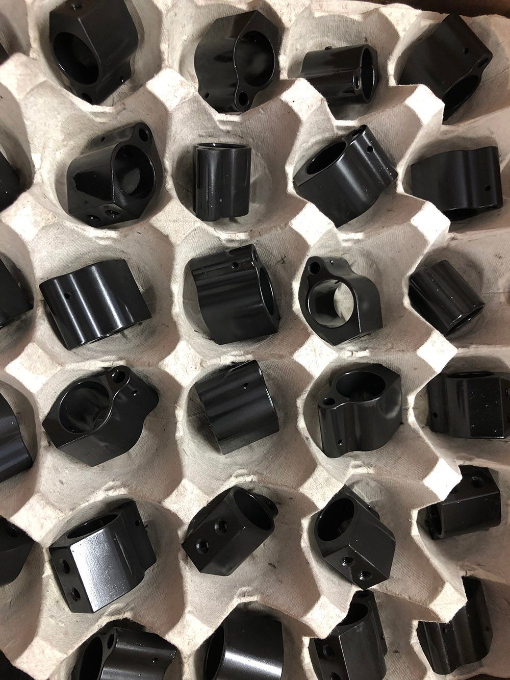 Glass beaded and black oxide plated steel parts by Seminole Metal Finishing.