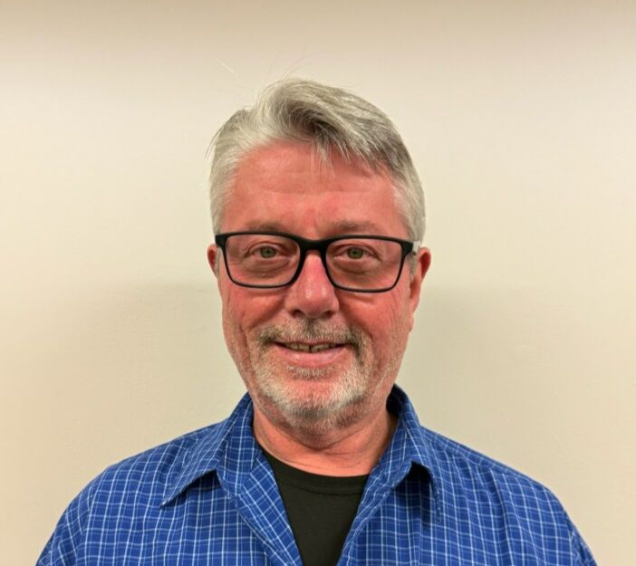 Silhouette of a person with a round head and a rectangular body.