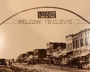 Vintage postcard of Clovis, CA, under a 