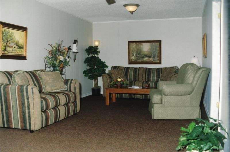 a living room with two couches and a coffee table