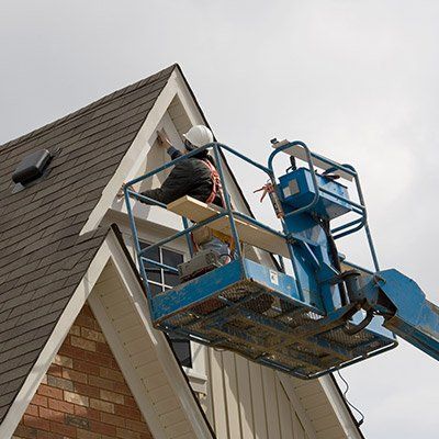 Metal Roof Repair — Worker Applying Roof Coatings in Exton, PA