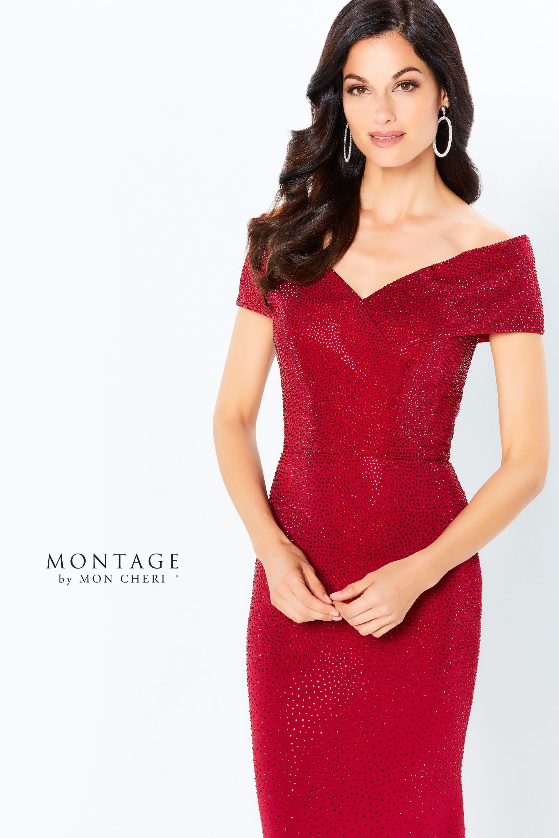 A woman is wearing a red sequined off the shoulder dress.