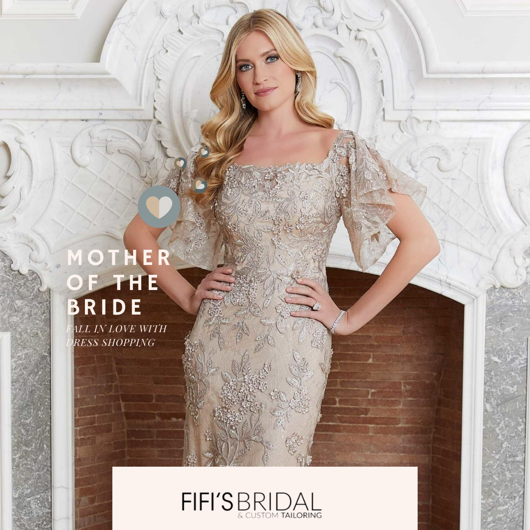 A woman is wearing a long blue dress with a high slit by MGNY