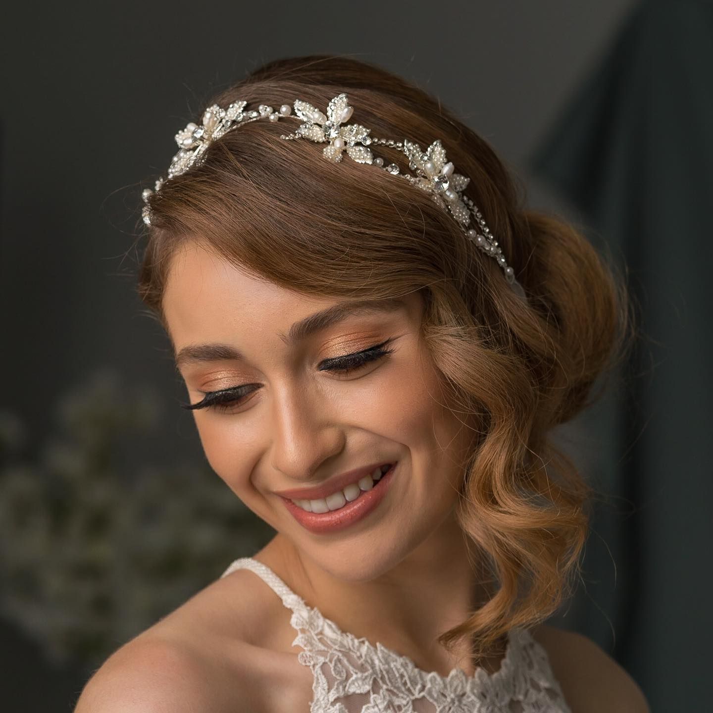 A woman wearing a headband with flowers on it