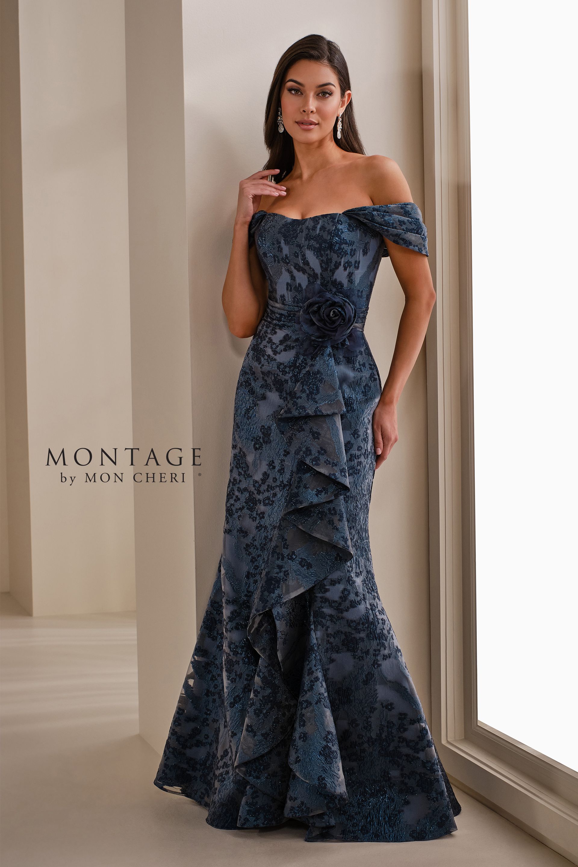 A woman is wearing a blue off the shoulder dress.