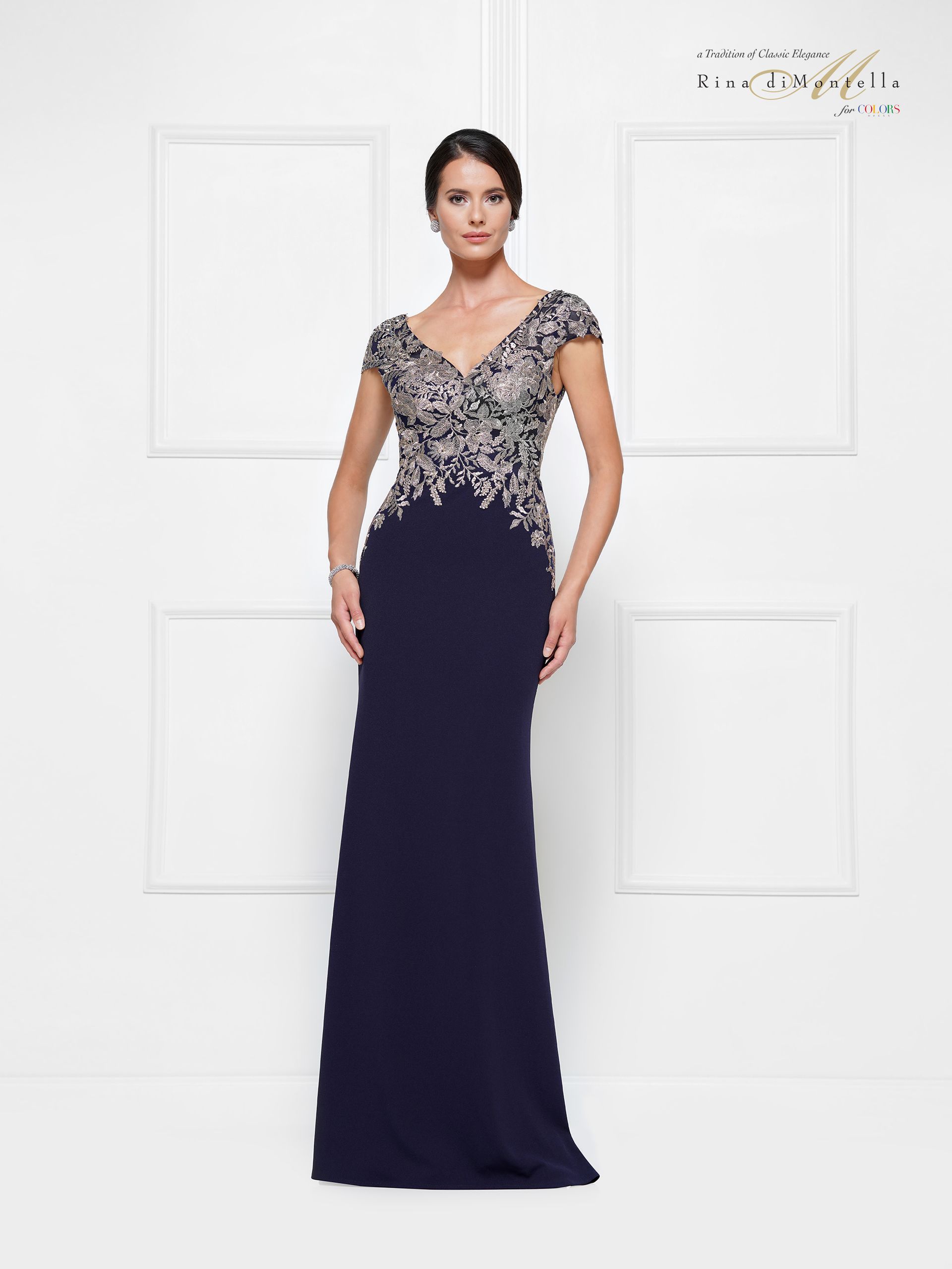 A woman is wearing a blue dress with a halter neckline