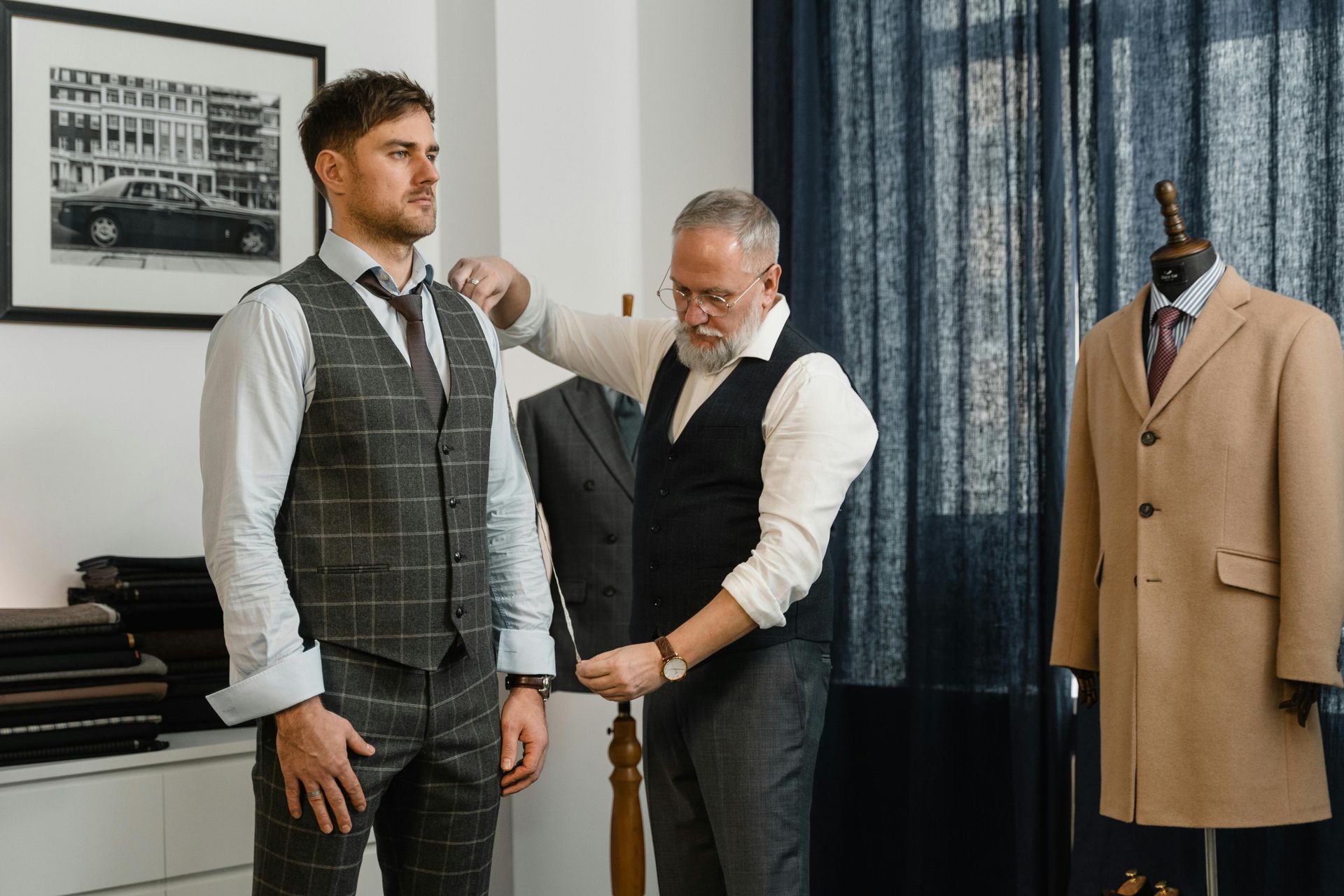 A man is getting a suit made by a tailor. A man is getting a suit made by a tailor.