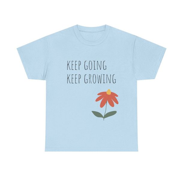 A light blue t-shirt with a flower on it that says keep going keep growing
