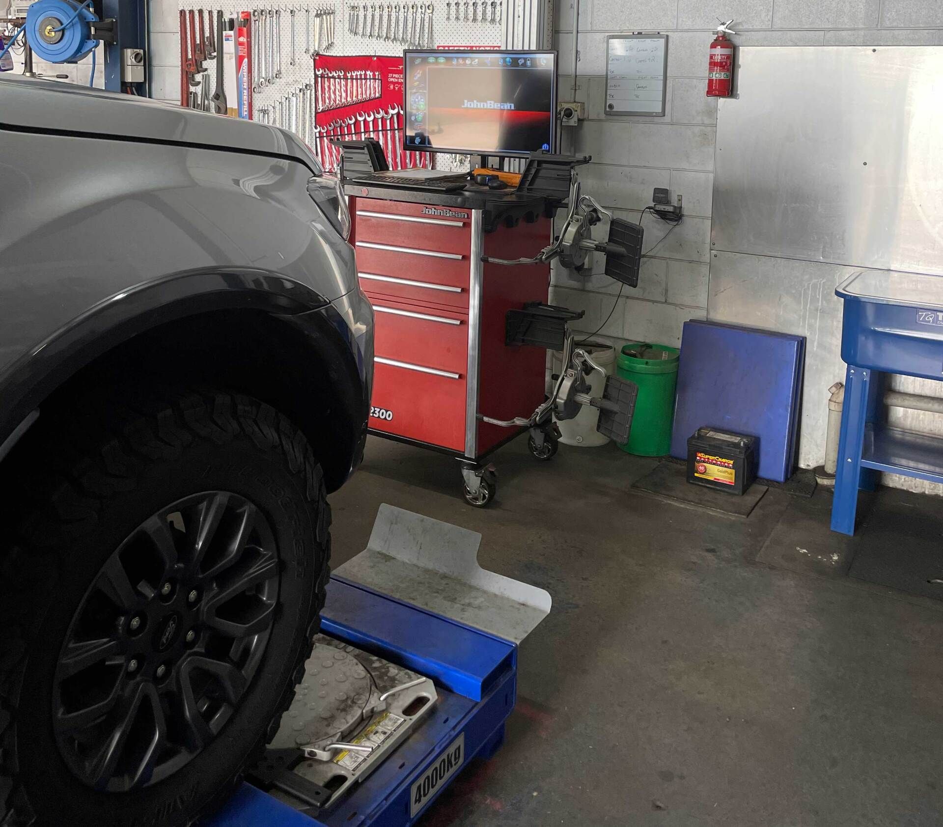 A Truck Tire on Alignment Machine in Auto Repair Shop — Dunn's Auto Repair in Bundaberg East, QLD