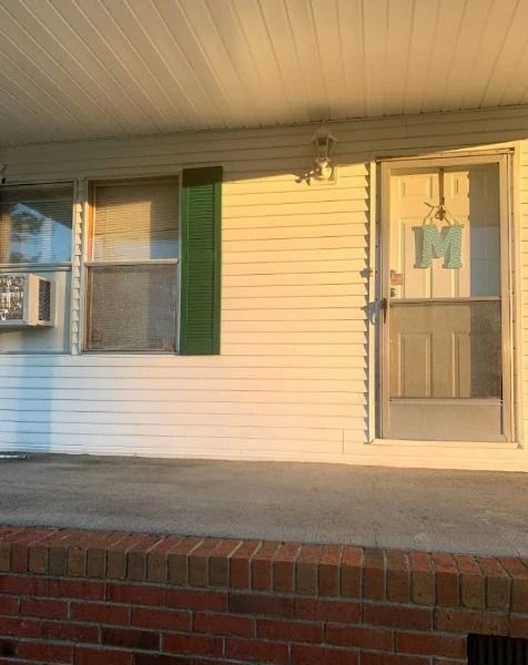 White house exterior with porch.