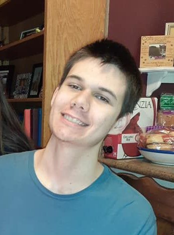 Silhouette of a person inside a light gray circle; features are a smaller circle above a larger rounded rectangle.