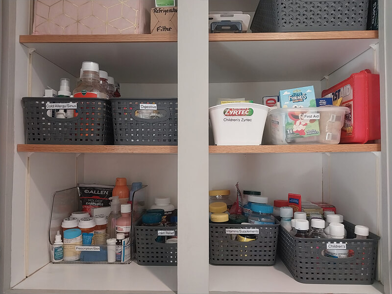A pantry with two shelves full of organized containers, bottles, and boxes.