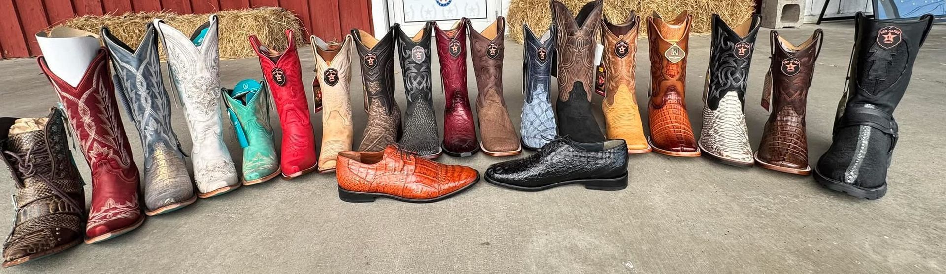 A stack of dingo cowboy boots are sitting on top of each other.