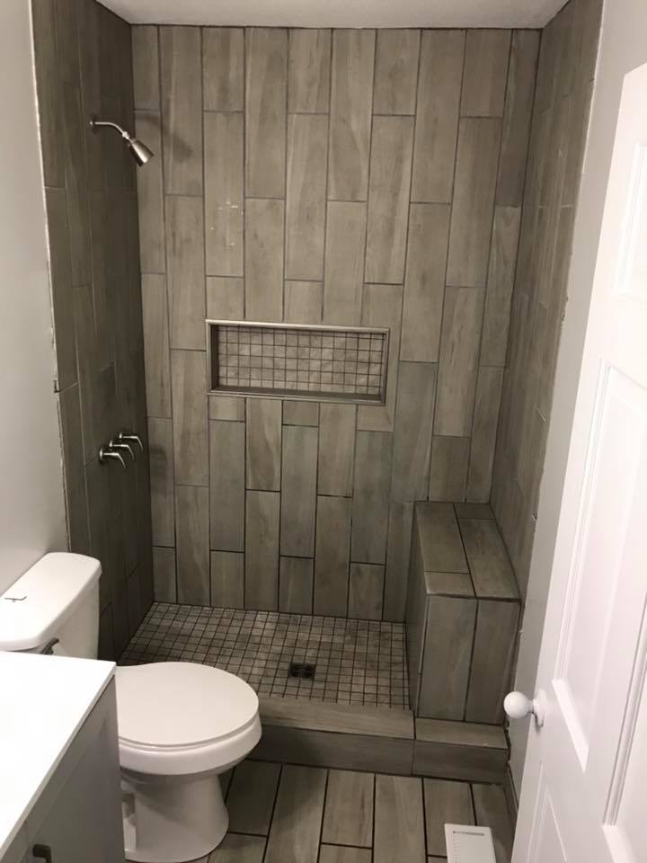 tiled shower done by a modern touch