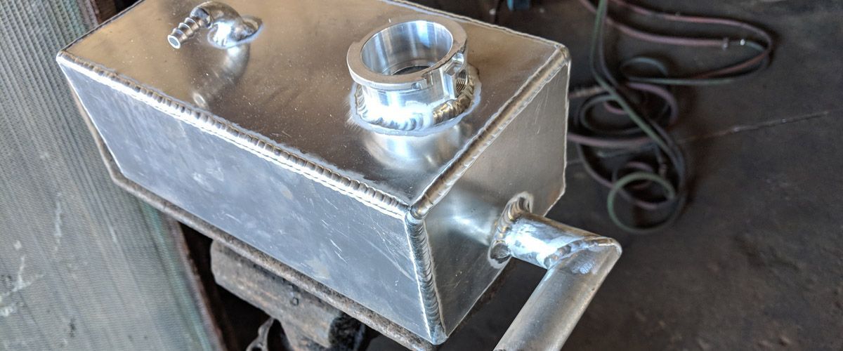 A close up of a welding joint on a metal surface - Kirk's Radiator & Auto A/C Inc.