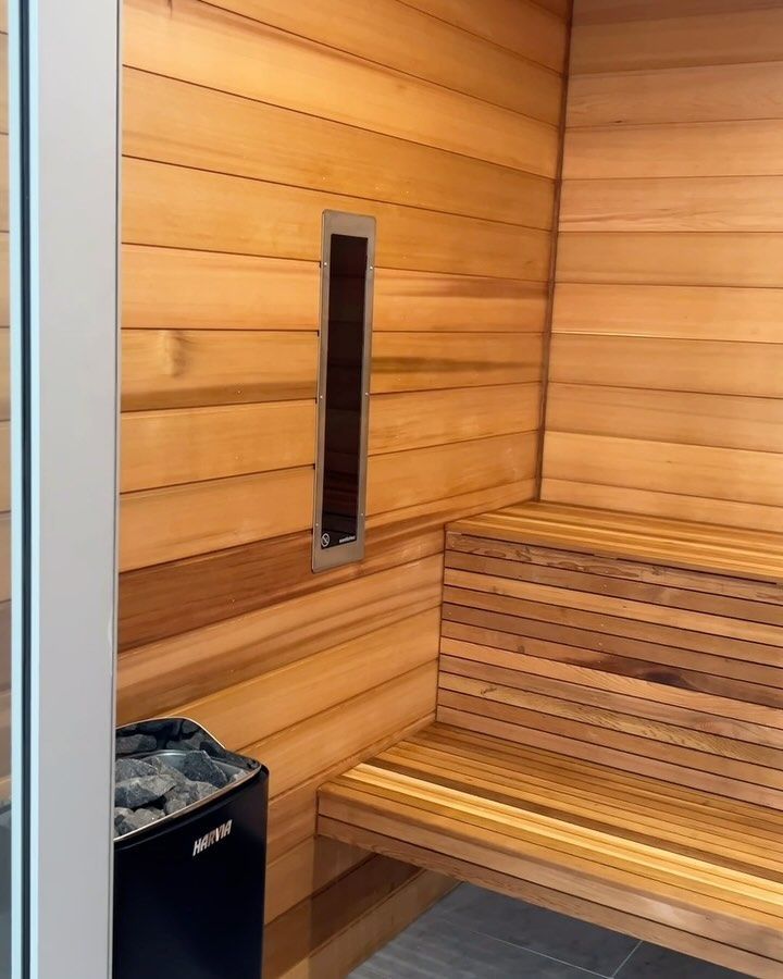 A Wooden Sauna With a Bench and a Heater — Byron Bay Carpentry and Construction In Suffolk Park, NSW
