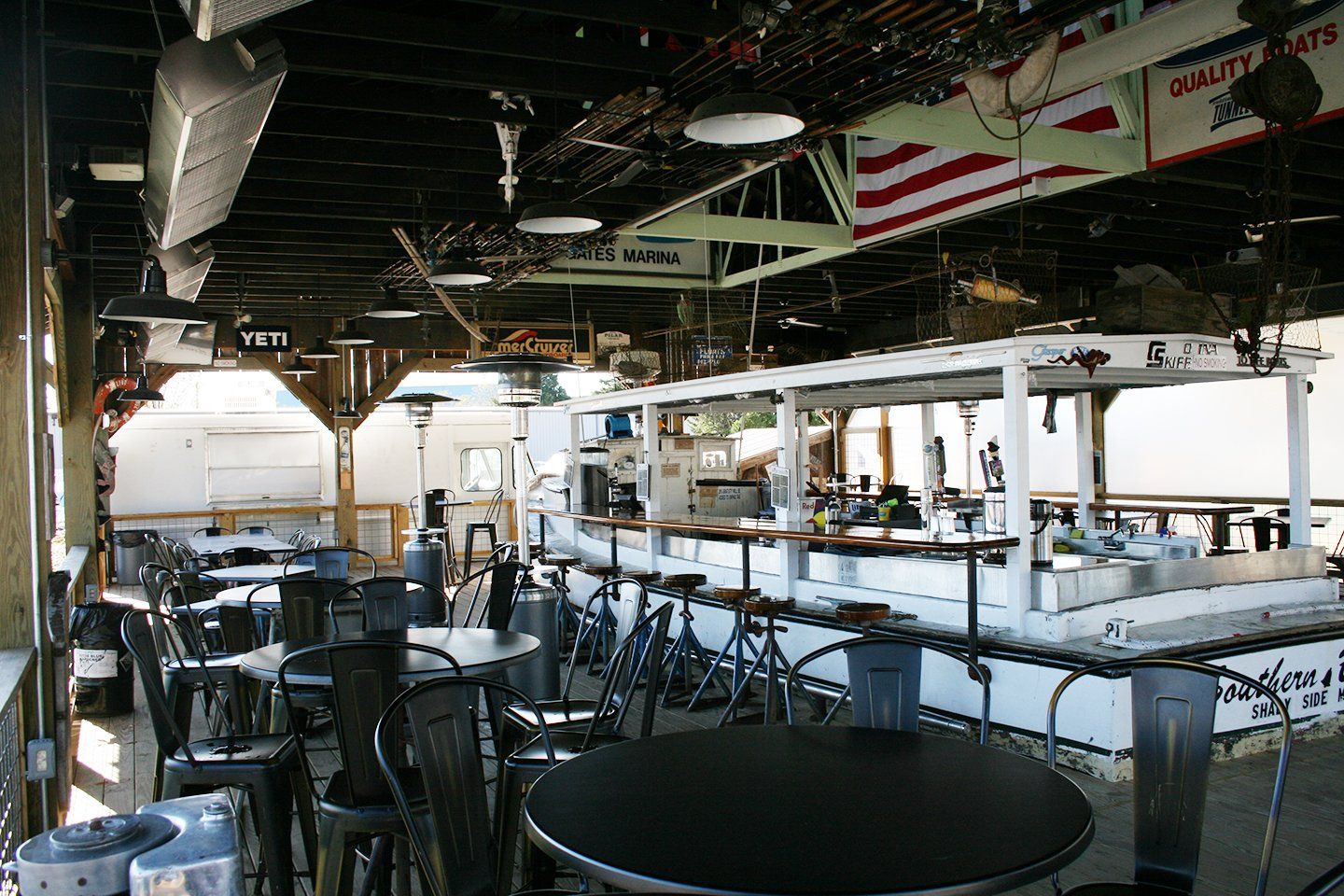 tables and barstools by Southern Belle in Boat House at Hidden Harbour