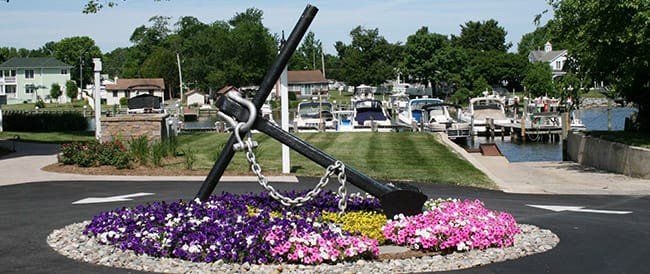 anchor in bed of flowers in driveway at Hidden Harbour