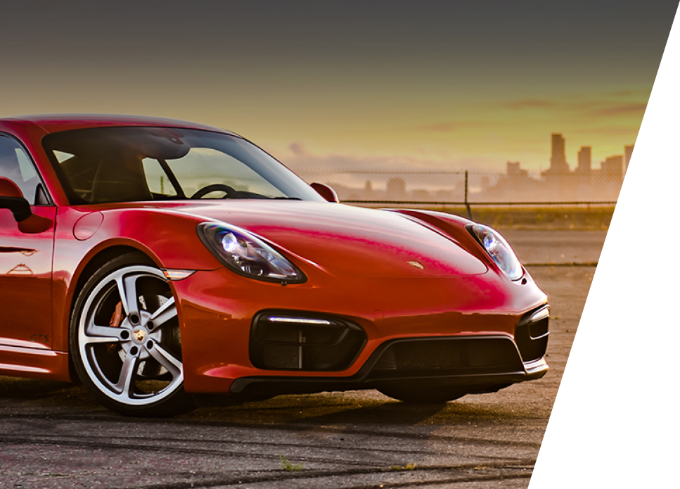 A red sports car is parked on the side of the road | Response Motors