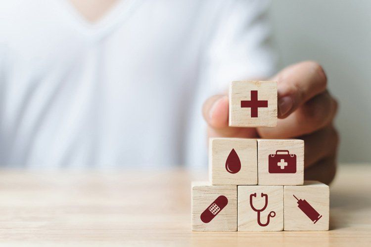 Hand Arranging Wood Blocks — Health Insurance in Australia