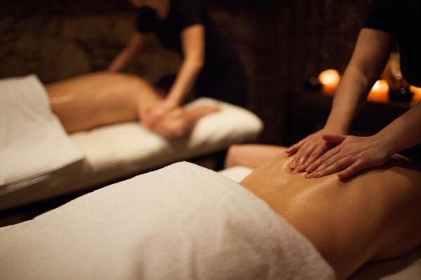 Two People Are Getting a Massage at a Spa