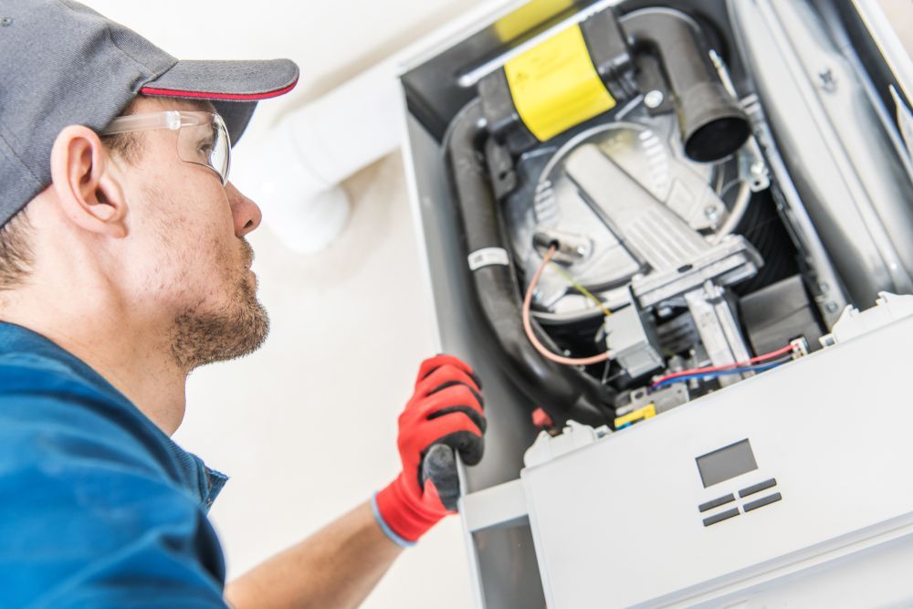 technician inspecting a gas heater