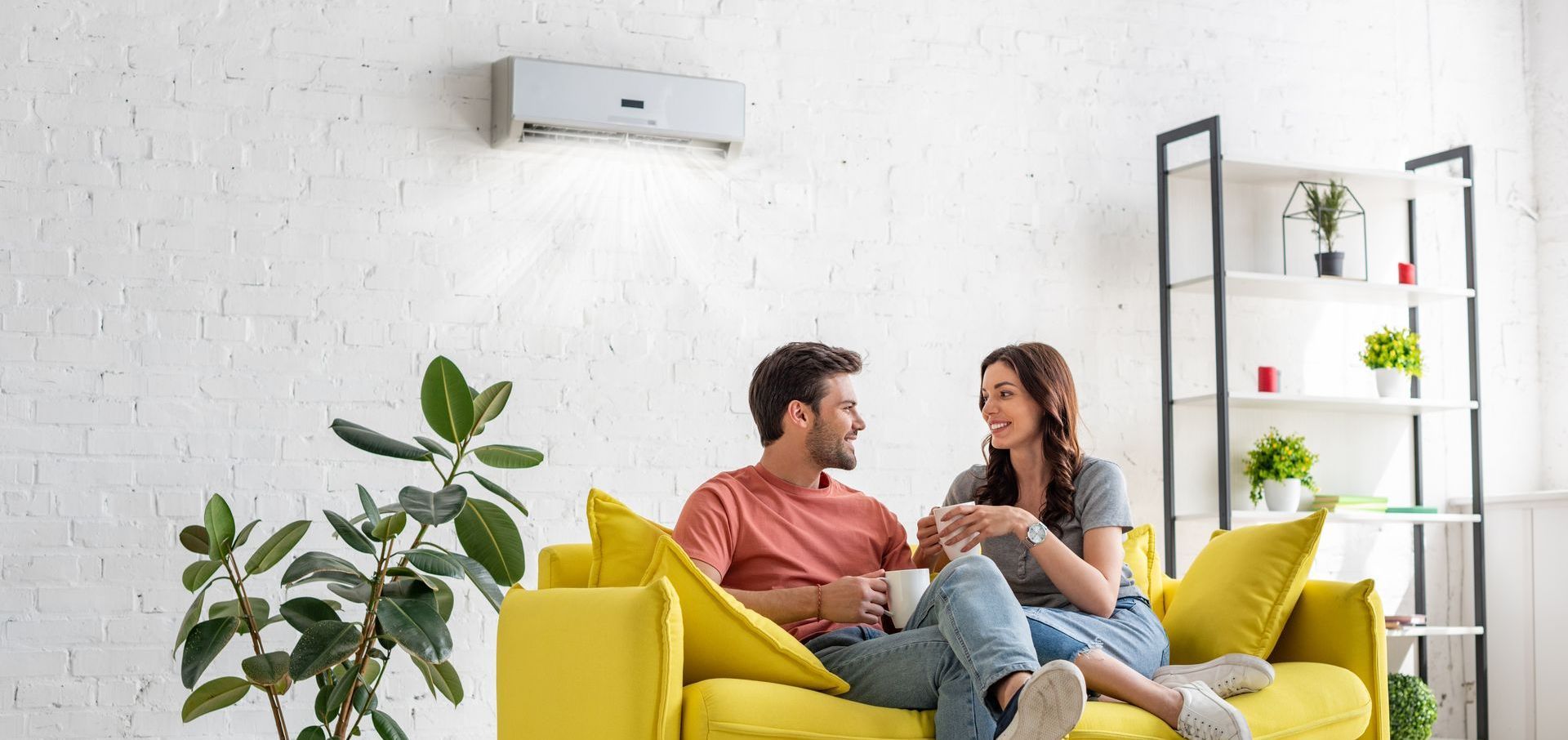 young couple enjoying their new ac