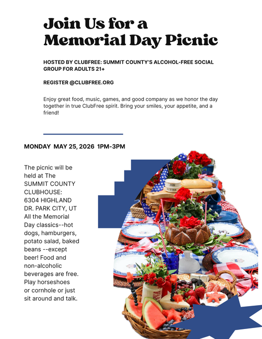 A Memorial Day picnic plate with a burger, hot dog, and fries, decorated with small American flags.