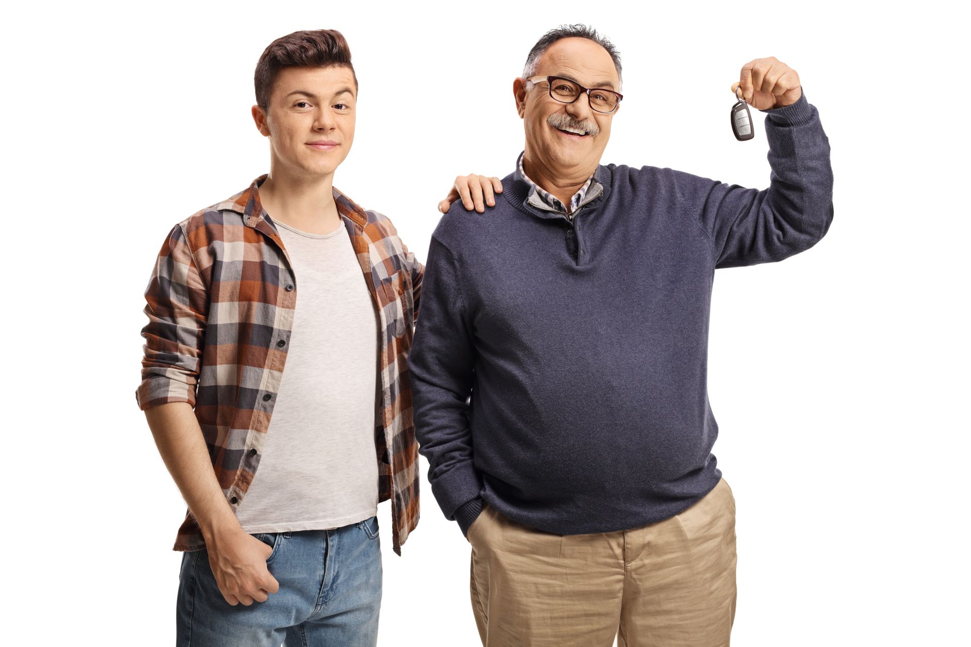 Teenager and older man smiling, the older man holding car keys, arm around the teen's shoulder.