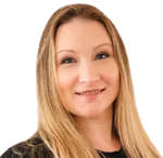 Woman with long blonde hair smiles at the camera.