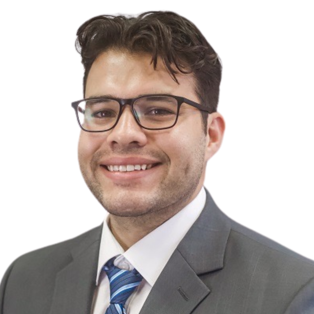 Woman with blonde hair and teal glasses smiles at the camera.