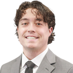 Woman with long blonde hair smiles at the camera.