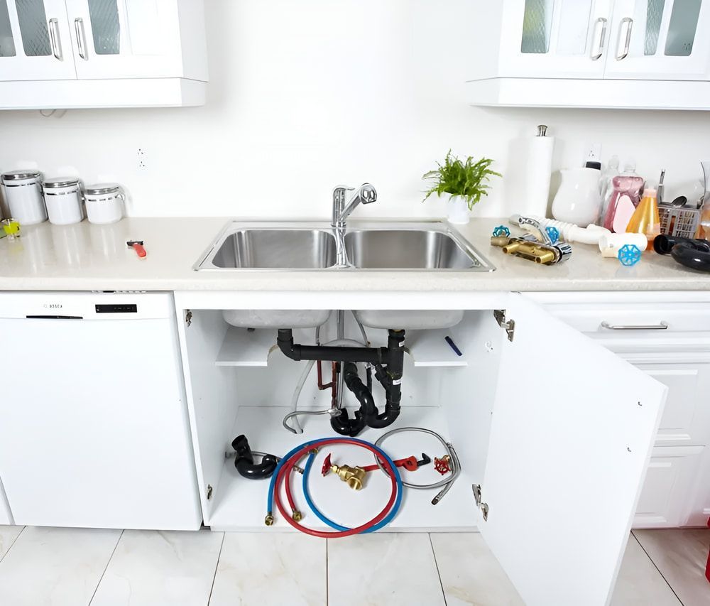 A Kitchen With A Sink And A Dishwasher With The Door Open — Aquafix Plumbing Services in Bowral, NSW