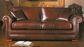 a beautiful leather sofa with matching cushion covers