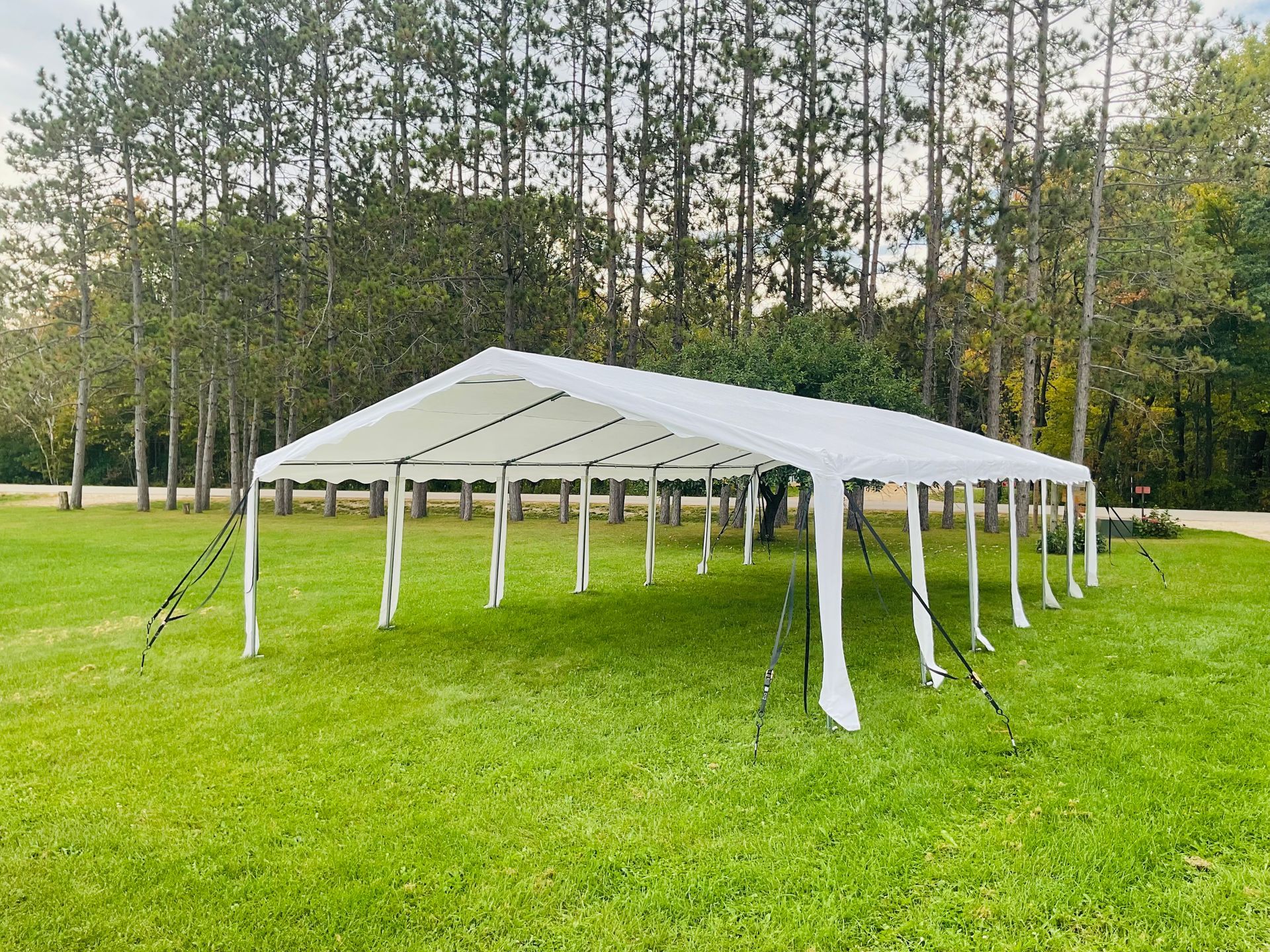 Tent, Tables with chairs, cooler with ice