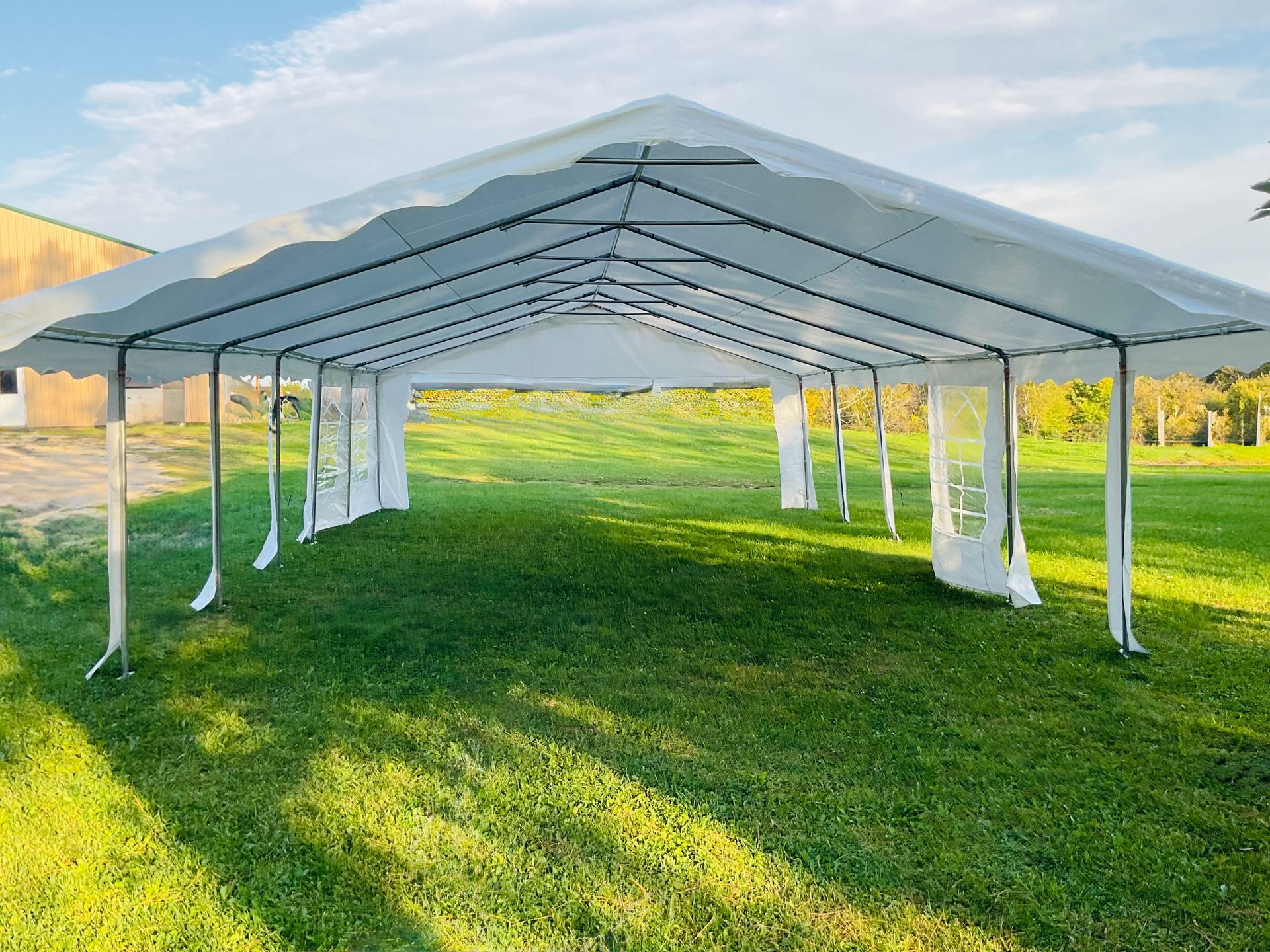 Tent, Tables with chairs, cooler with ice