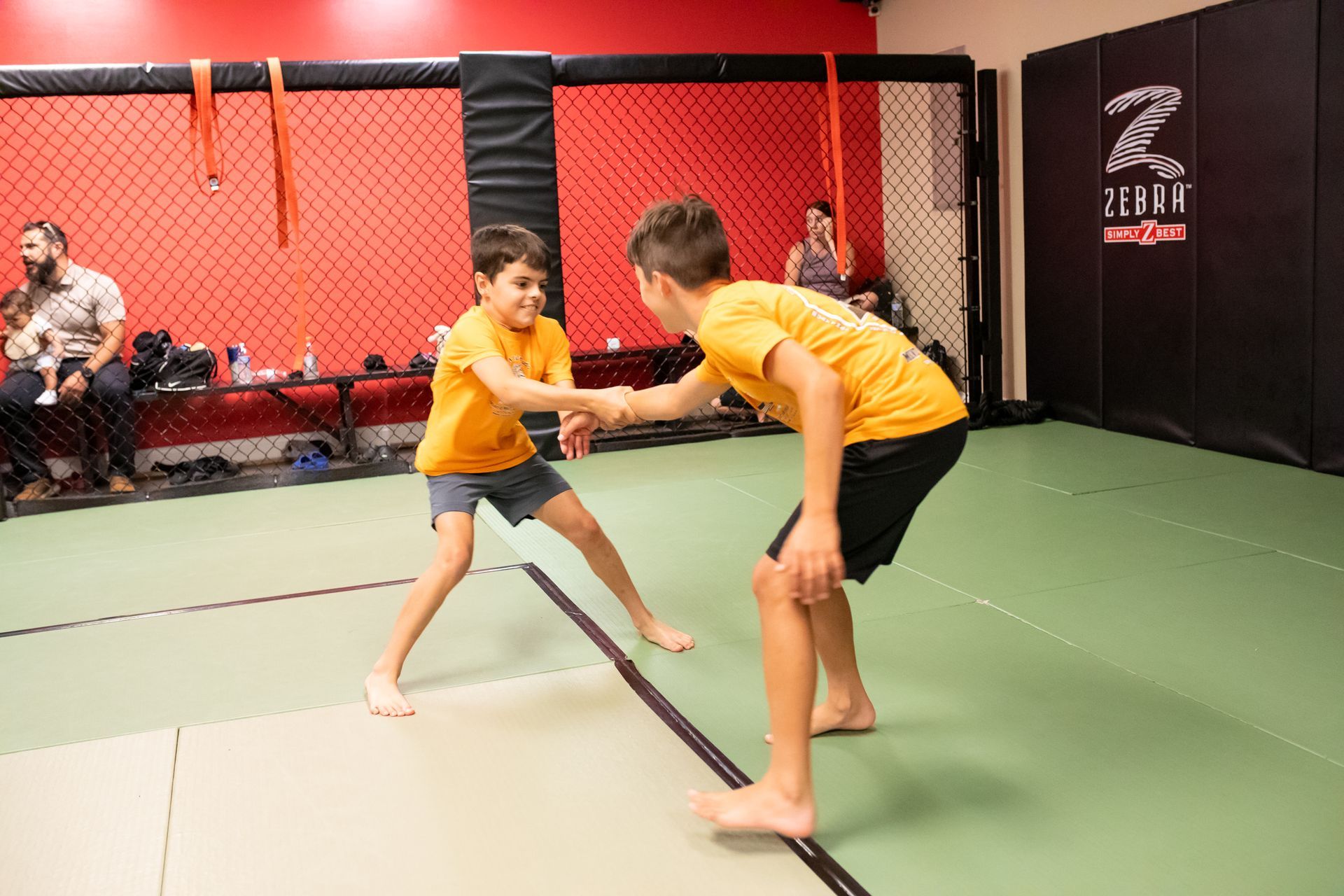 Students practicing controlled grappling at Mason Dixon Jiu-Jitsu in East Chambersburg, PA to build focus and grit