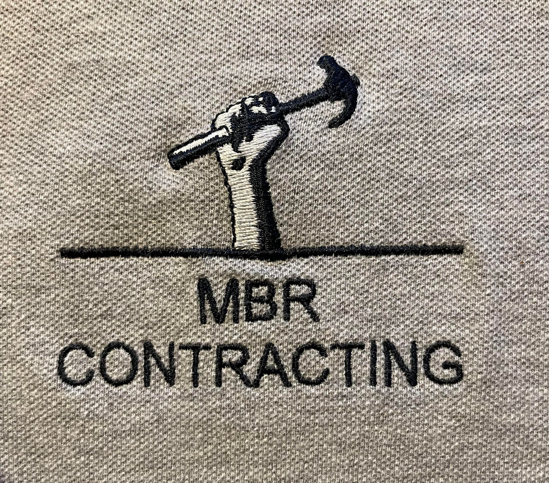 Logo for MBRCONTR, a construction company, featuring a blue house icon and the company name.