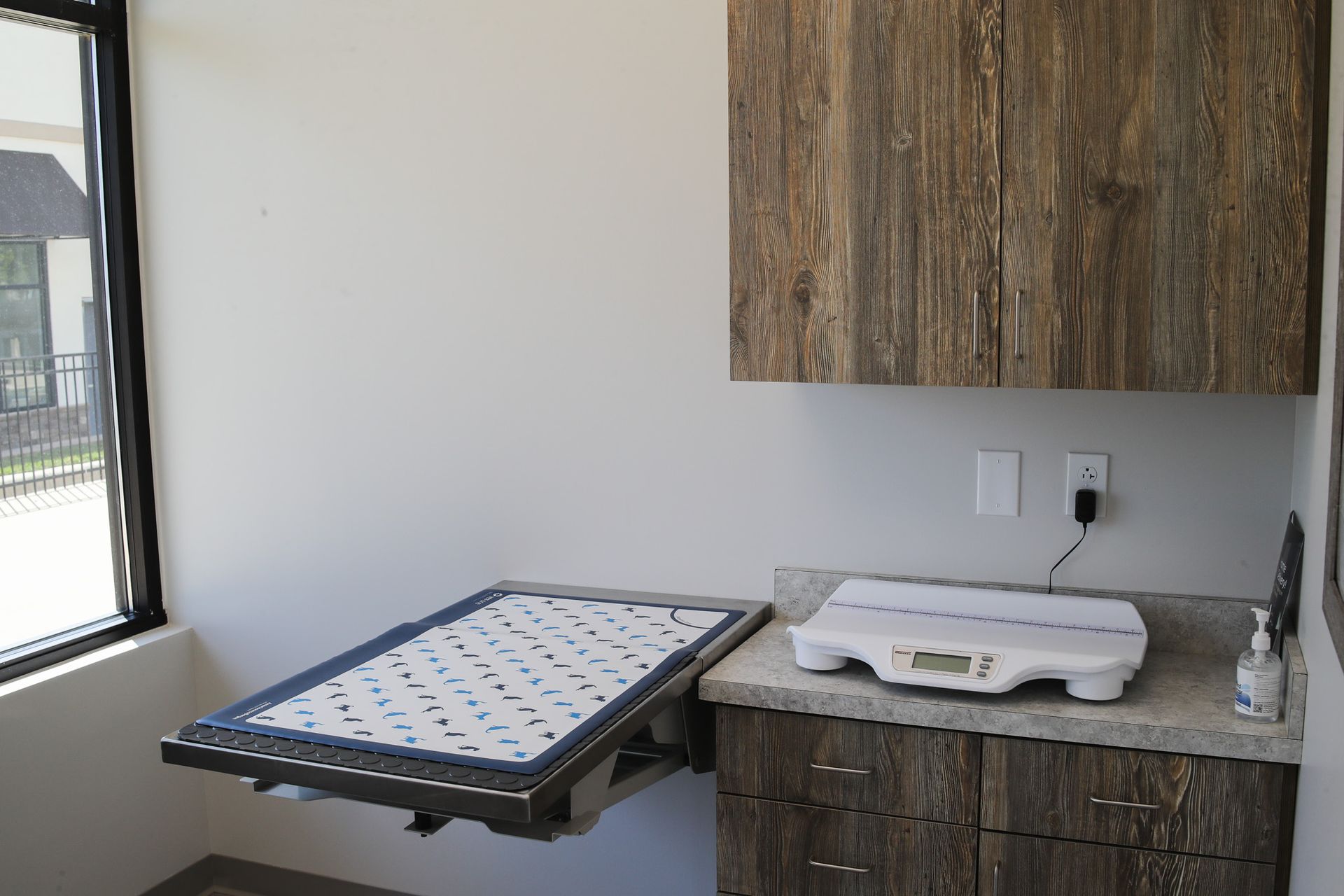 There is a scale on the counter in the room.