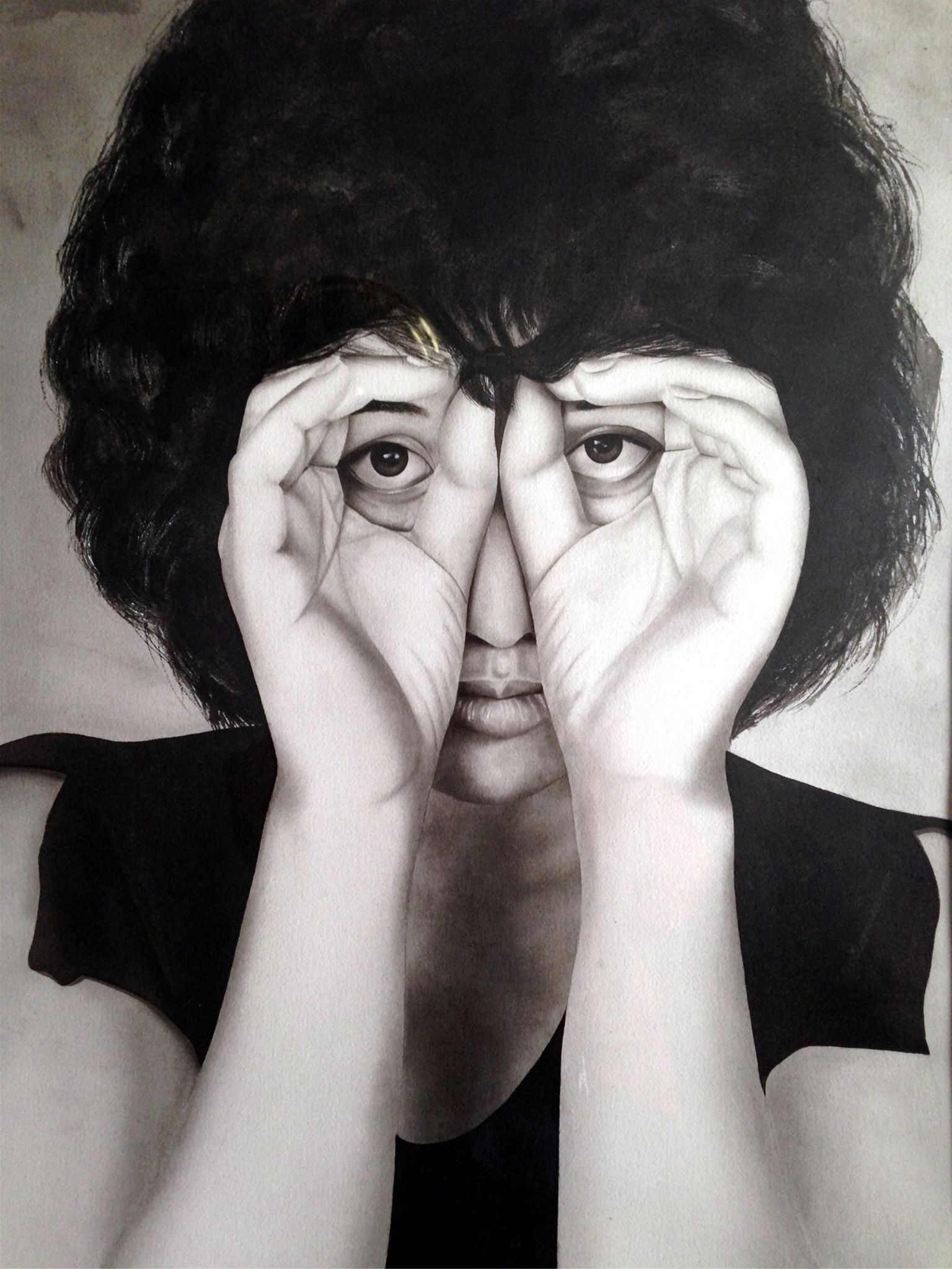 A black and white photo of a woman covering her eyes with her hands