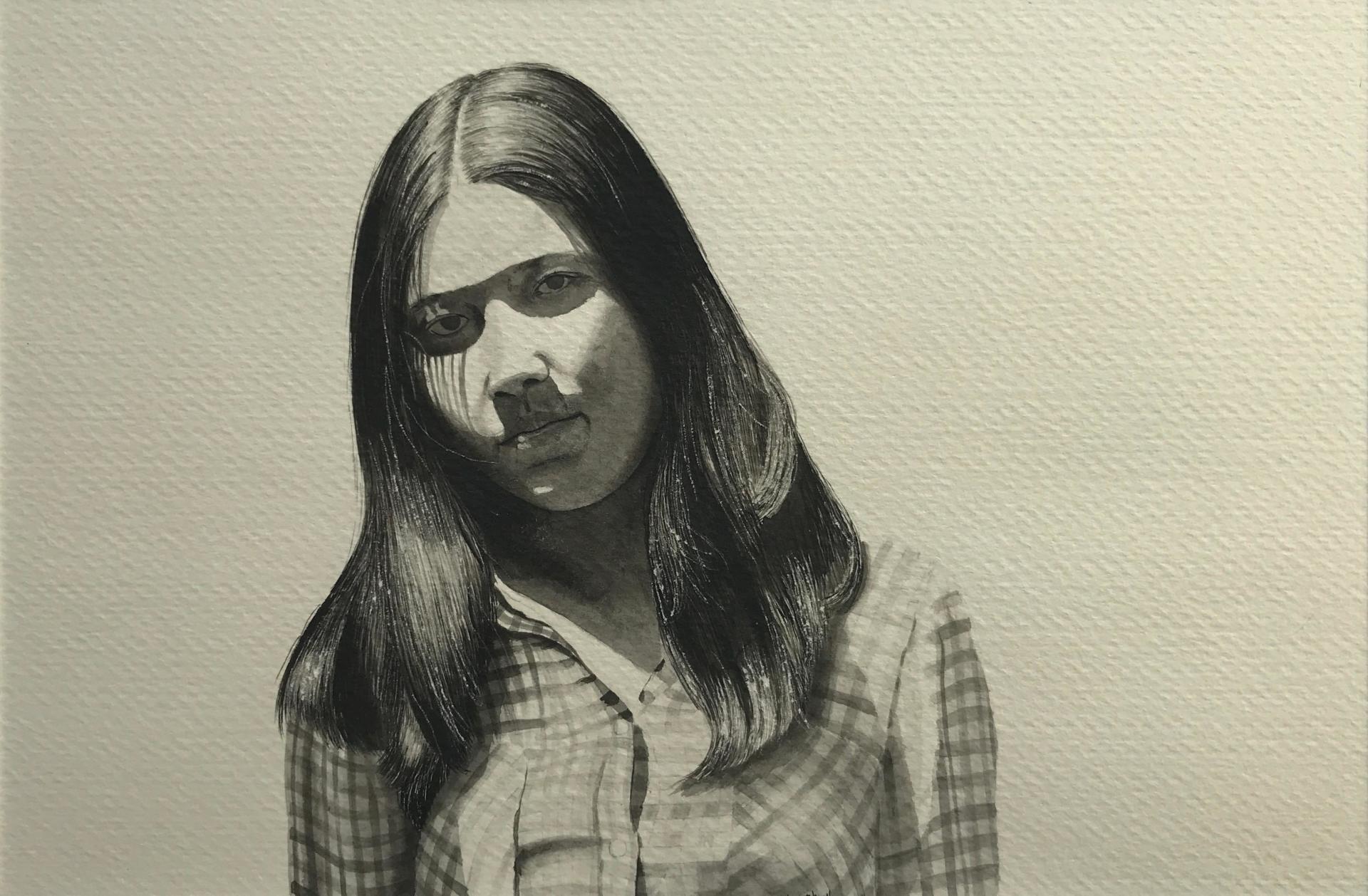 A black and white photo of a woman with long hair