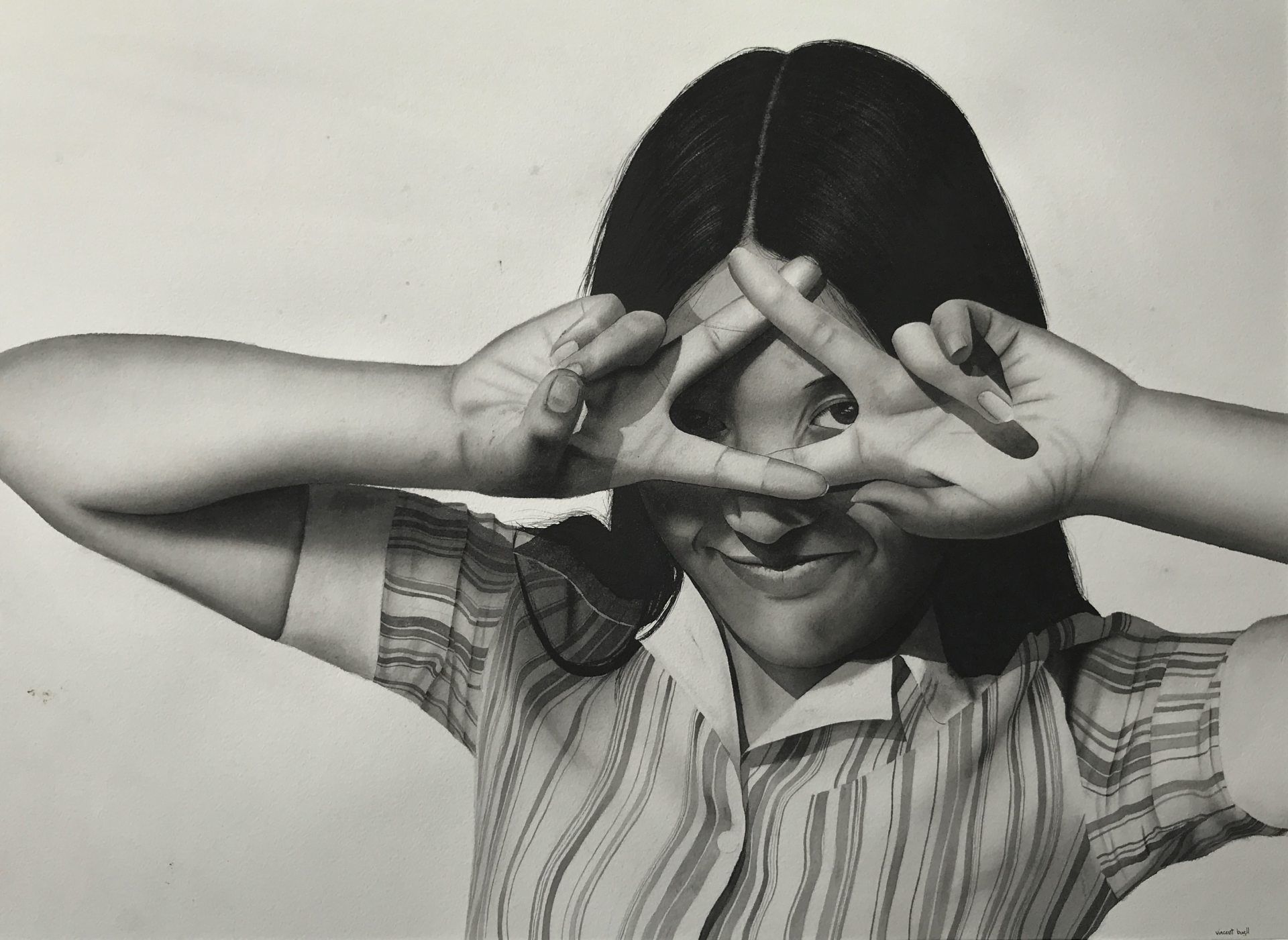 A woman covering her eyes with her hands in a black and white photo