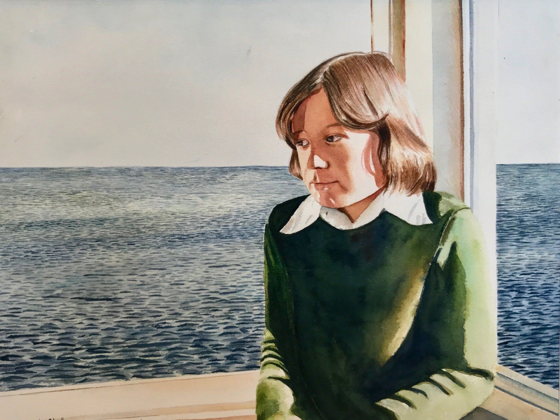 A woman in a green sweater is looking out a window at the ocean