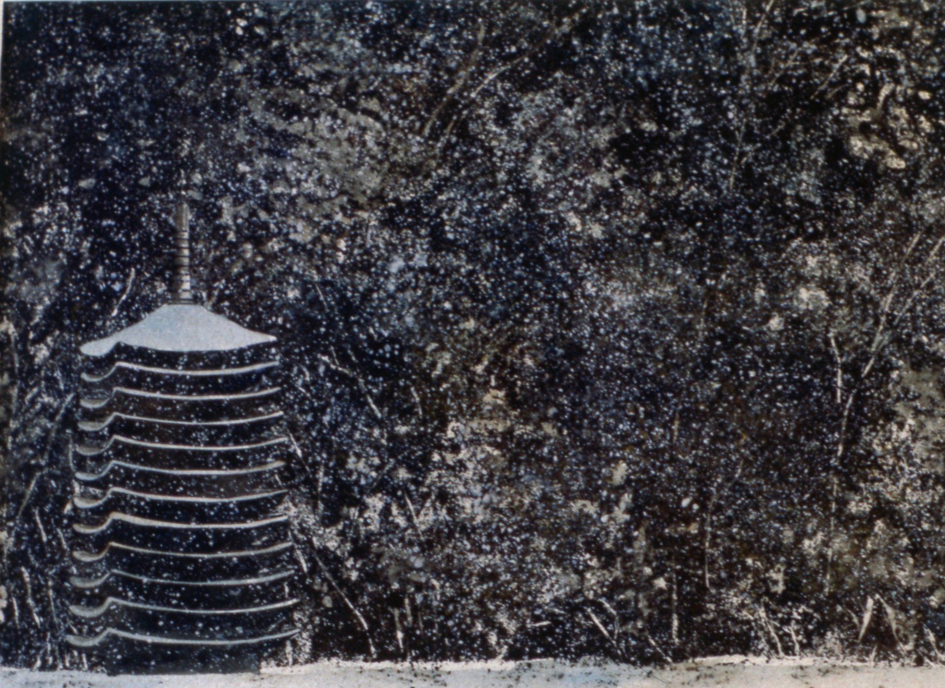 A black and white photo of a building in the snow
