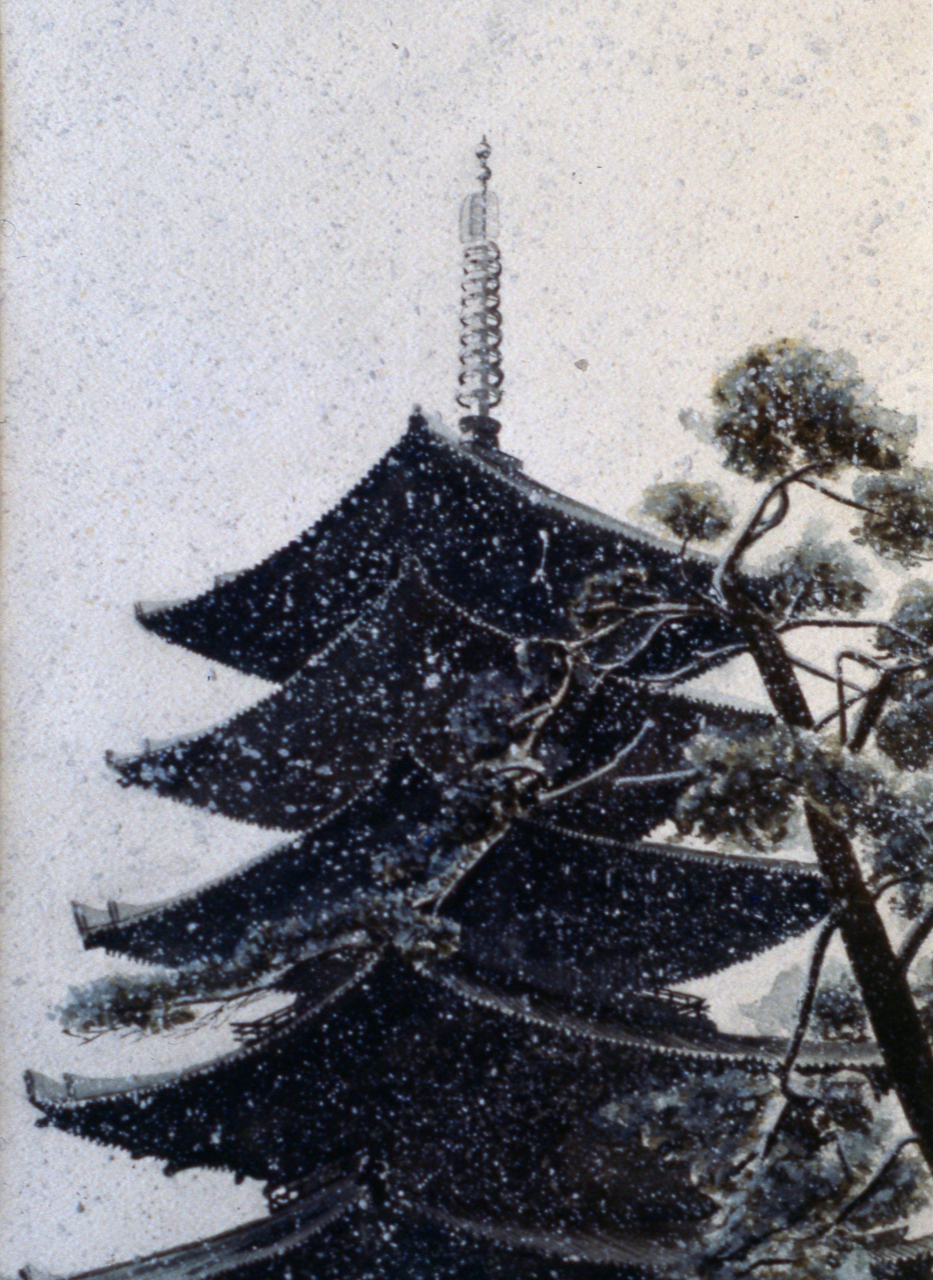 A black and white photo of a pagoda in the snow