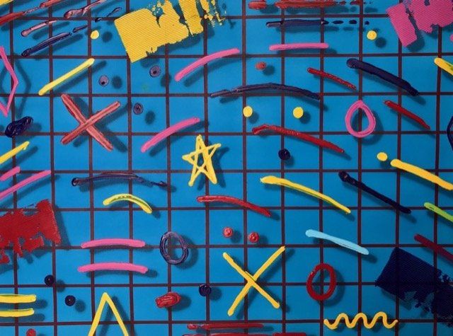 A blue grid with a lot of colorful objects on it