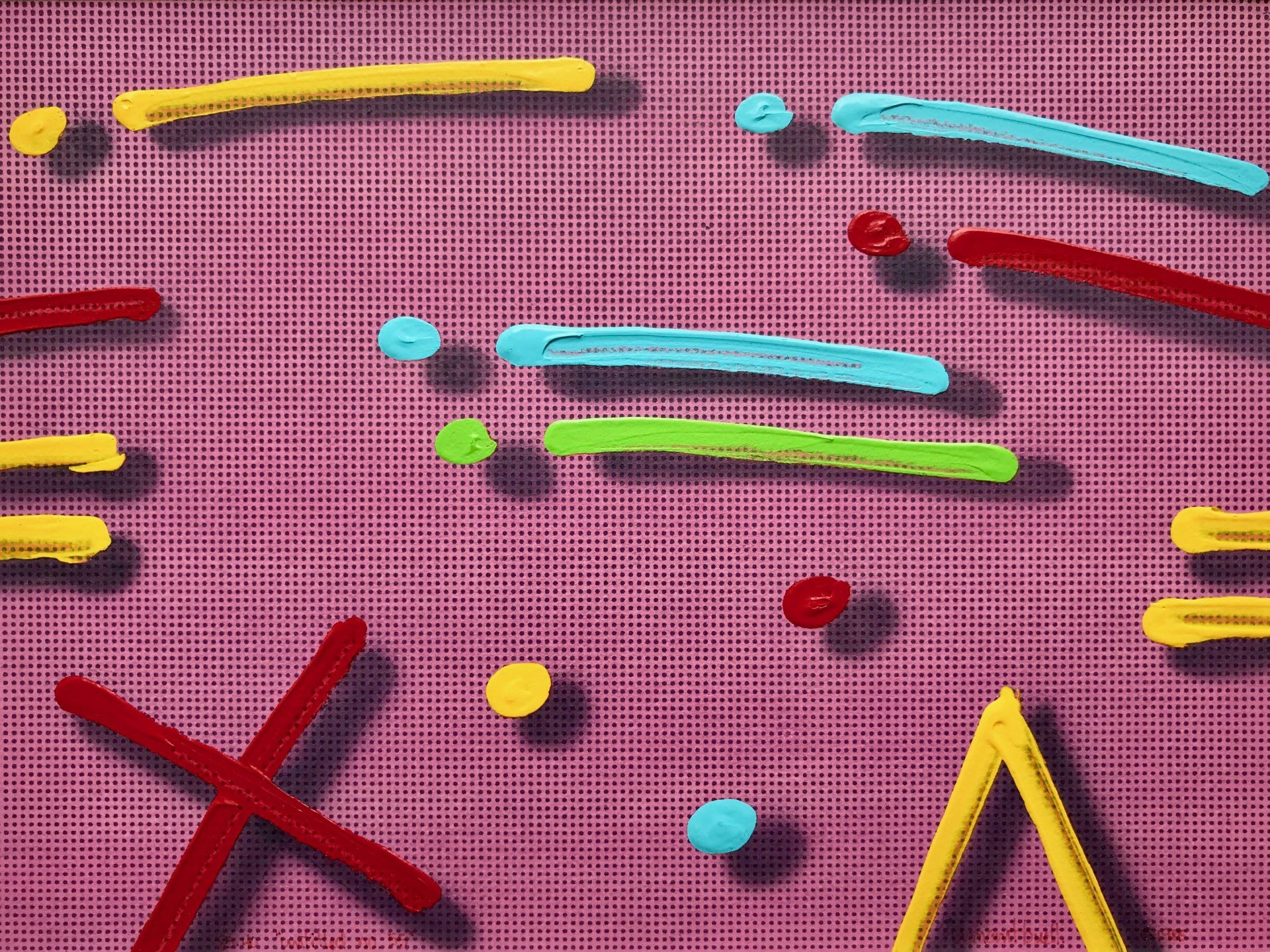 A purple surface with a bunch of colorful objects on it.